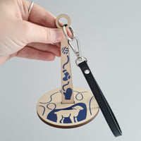 Portable, rotating wrist yarn holder, blue sheep