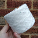 400m of 2 ply wool white & 1 ply thread with tiny sequins